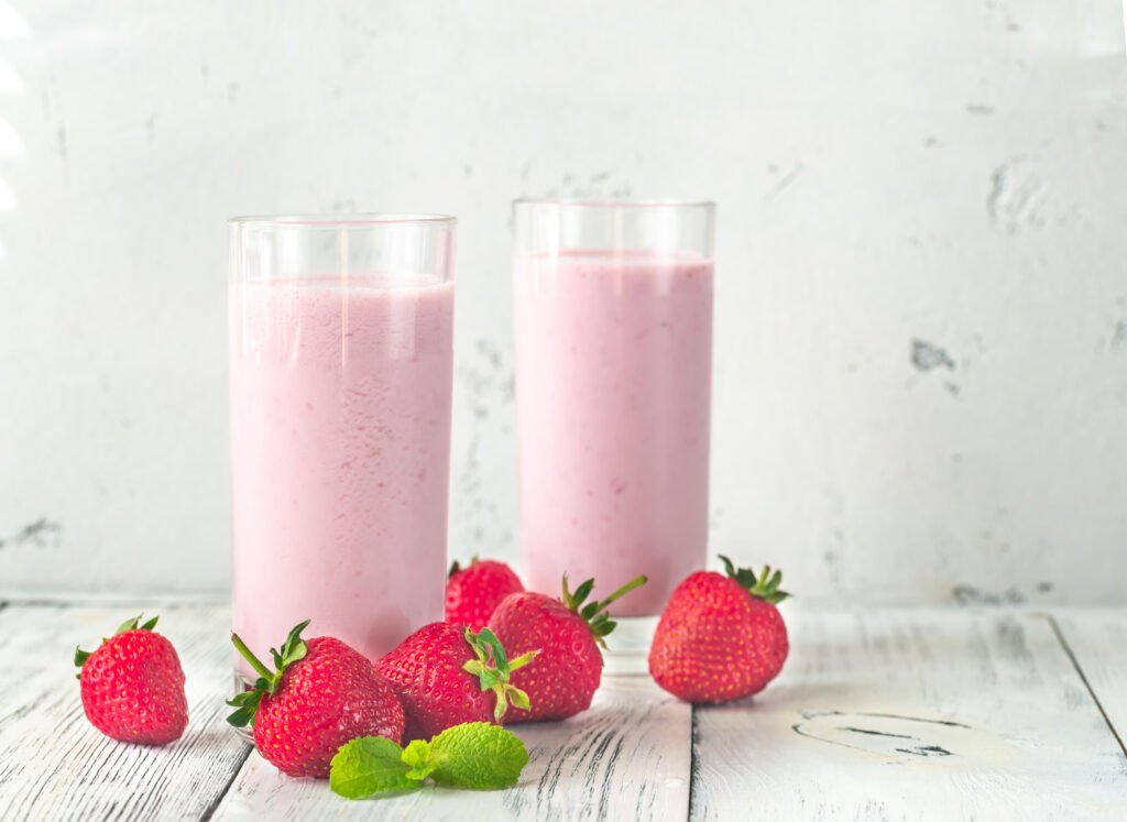 Two,Glasses,Of,Strawberry,Shake,With,Fresh,Strawberries
