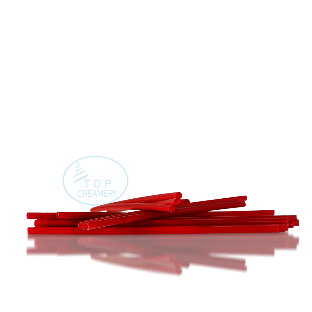 Red plastic straws scattered on a glossy black surface with a blue Top Creamery logo.