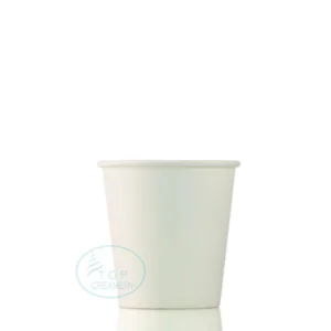 White disposable paper cup on a reflective surface with a faint blue Top Creamery watermark.